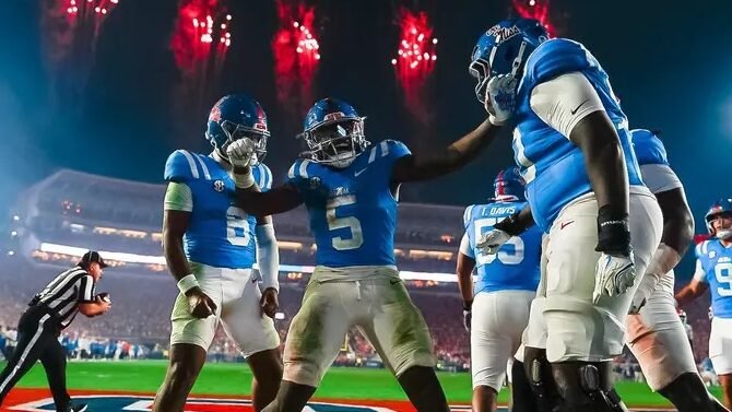 Ole Miss players celebrate a touchdown with Kewan Lacy against South Carolina.