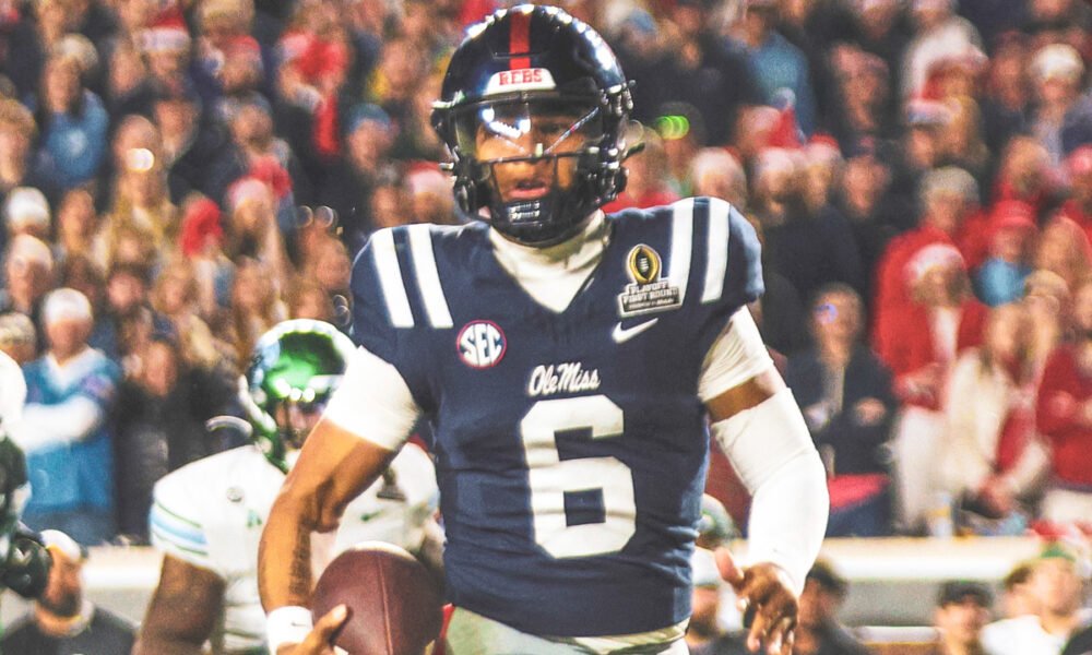 Ole Miss Rebels quarterback Trinidad Chambliss carries the ball against the Tulane Green Wave