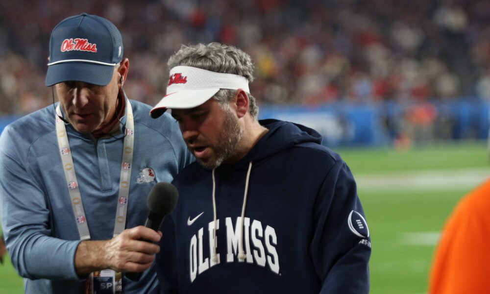 Ole Miss coach Pete Golding talks on the field during a radio interview at the Fiesta Bowl on Thursday. | Bill Taylor-HottyToddy.com Images