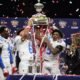 Ole Miss players celebrate with the Sugar Bowl trophy after defeating Georgia 39-34. | Ole Miss Athletics