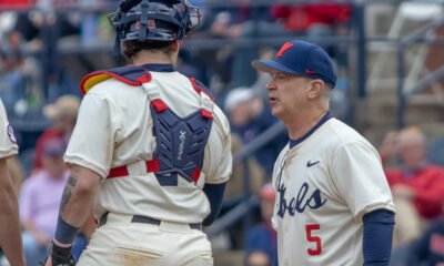 Ole Miss coach Mike Bianco coming to the mound against Nevada