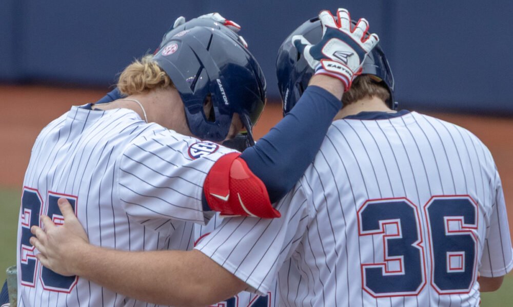 Ole Miss Rebels Daniel Pacella with teammates after hitting homer