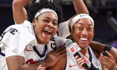 Ole Miss senior Christeen Iwuala, left, celebrates with Cotie McMahona in a post-game television interview after Monday's win against Auburn. | Ole Miss Athletics