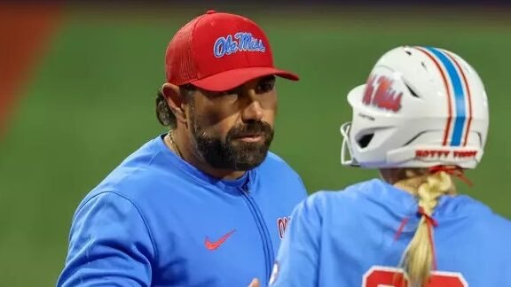 Ole Miss assistant coach Bobby Buchanan talks with Taylor Malvin during a SEC game against No. 4 Oklahoma. | Ole Miss Athletics