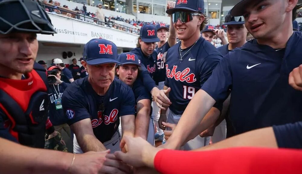 Ole Miss baseball players and coach Mike Bianco huddle before the start of a game against No. 15 Kentucky. | Ole Miss Athletics