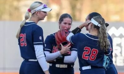 Ole Miss softball players huddle in the infield during a loss to Oklahoma in Oxford. | Ole Miss Athletics
