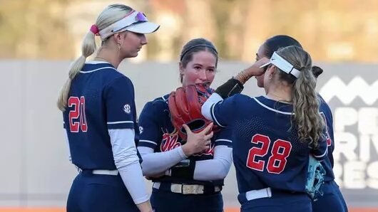 Ole Miss softball players huddle in the infield during a loss to Oklahoma in Oxford. | Ole Miss Athletics