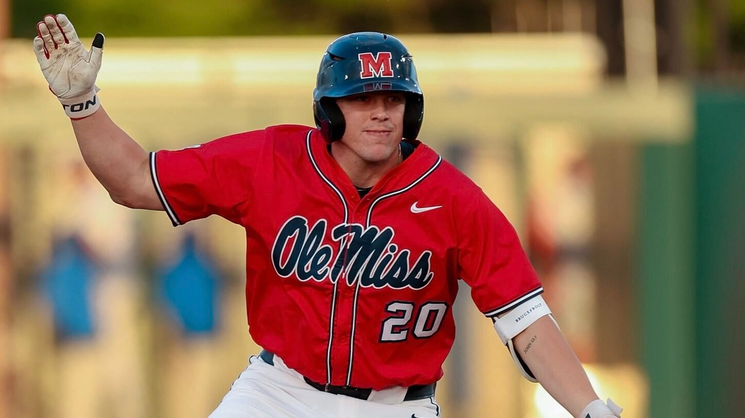 Ole Miss designated hitter Collin Reuter celebrates a base hit during a SEC game against No. 21 Florida. | Ole Miss Athletics