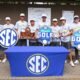 Ole Miss men's golf team poses for photos with the 2026 SEC championship trophy and medals. | Ole Miss Athletics