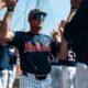 Ole Miss outfielder Cannon Goldin high-fives teammates in the dugout before Saturday's game against Tennessee. | Ole Miss Athletics