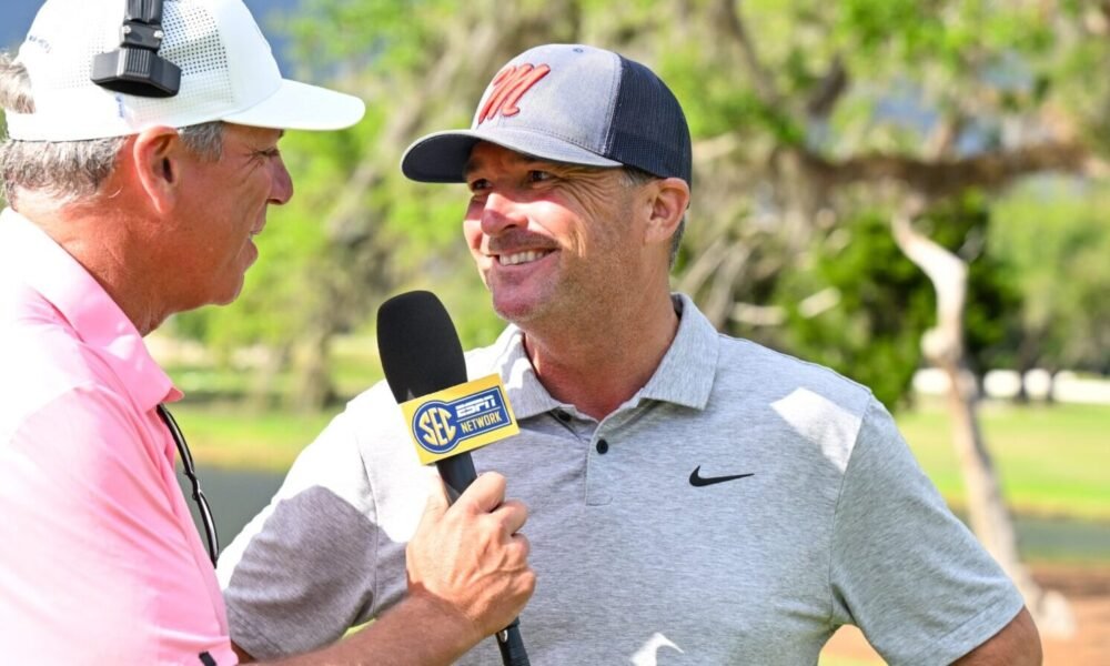 Ole Miss coach Chris Malloy talks to a television reporter after the Rebels secured a spot in the championship match. | Ole Miss Athletics