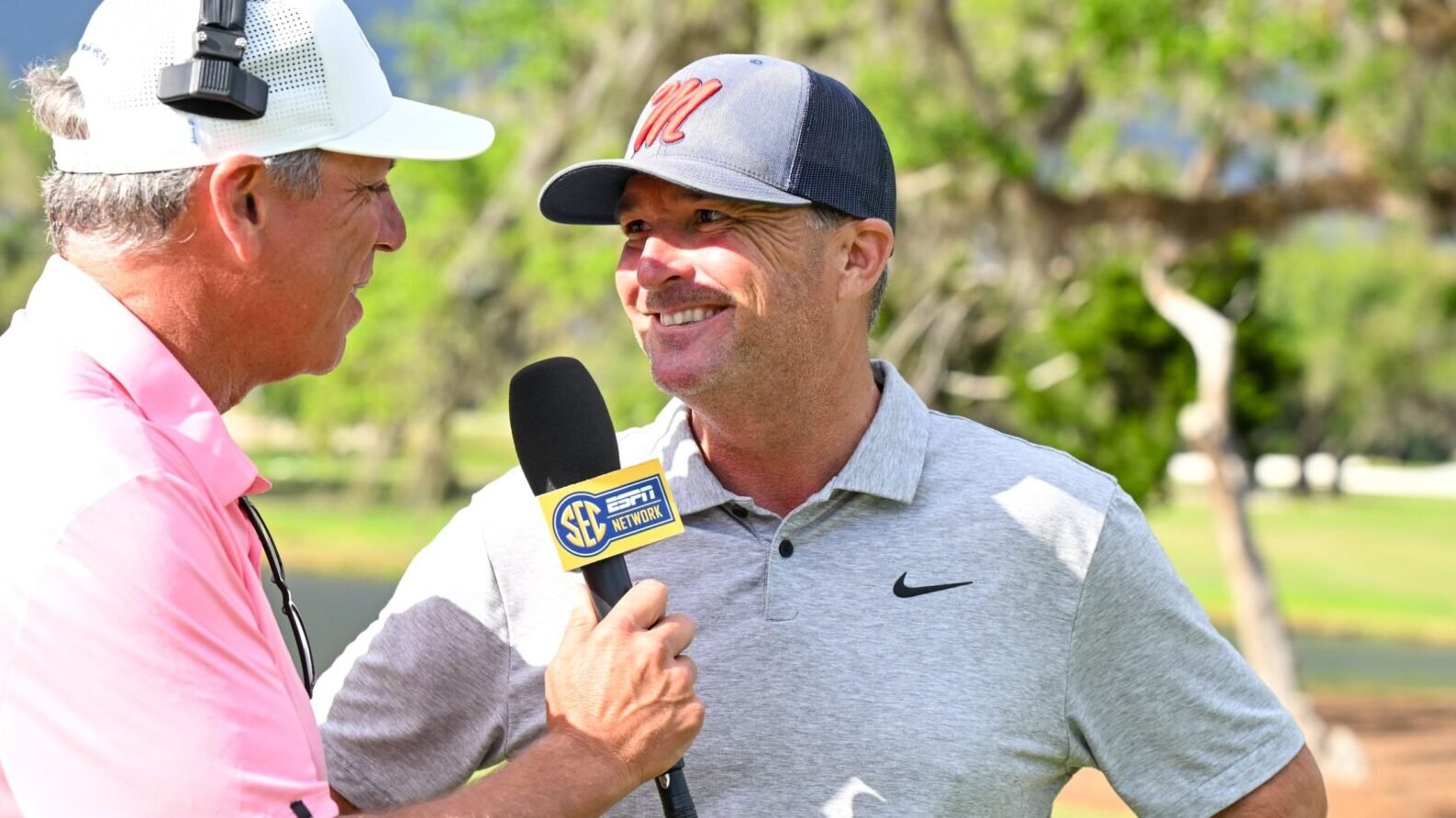 Ole Miss coach Chris Malloy talks to a television reporter after the Rebels secured a spot in the championship match. | Ole Miss Athletics