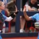 Ole Miss softball players high five during Sunday's game against No. 13 Texas A&M in Osxford. | Ole Miss Athletics