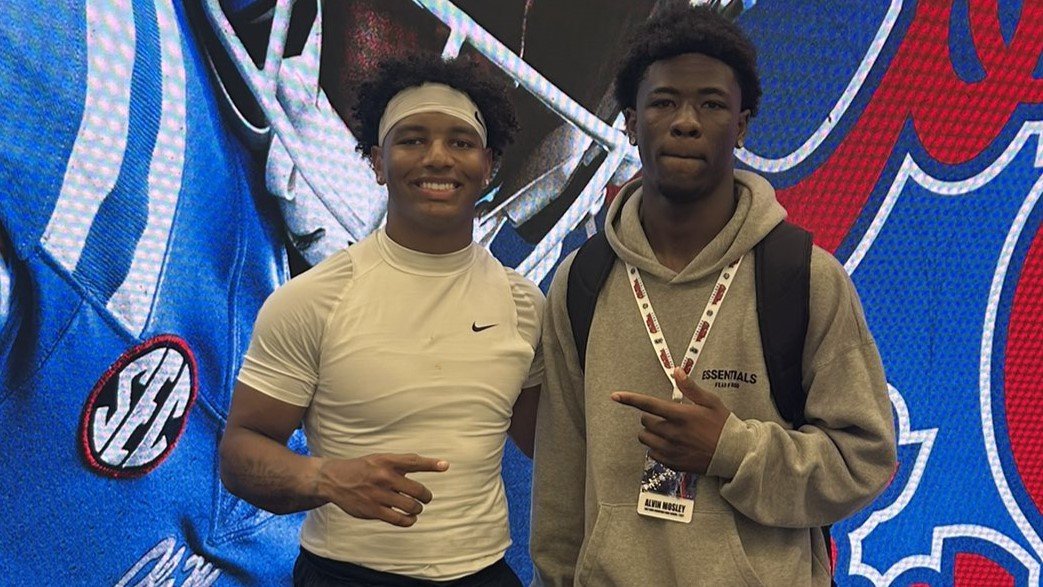 Ole Miss quarterback Trinidad Chambliss, left, with Crawford wide receiver Alvin Mosley. | Alvin Mosley/X