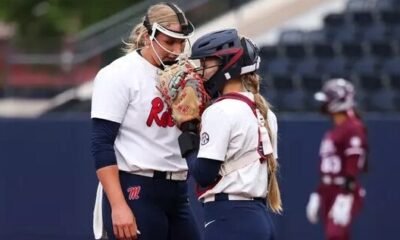 Ole Miss pitcher Emilee Boyer and catcher Kennedy Bunker talk strategy during an SEC game against Mississippi State. | Ole Miss Athletics