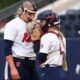 Ole Miss pitcher Emilee Boyer and catcher Kennedy Bunker talk strategy during an SEC game against Mississippi State. | Ole Miss Athletics